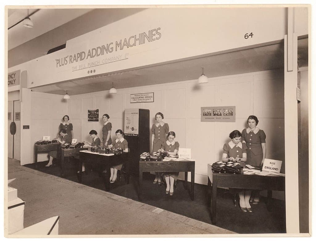 A vintage adding machine on a desk
